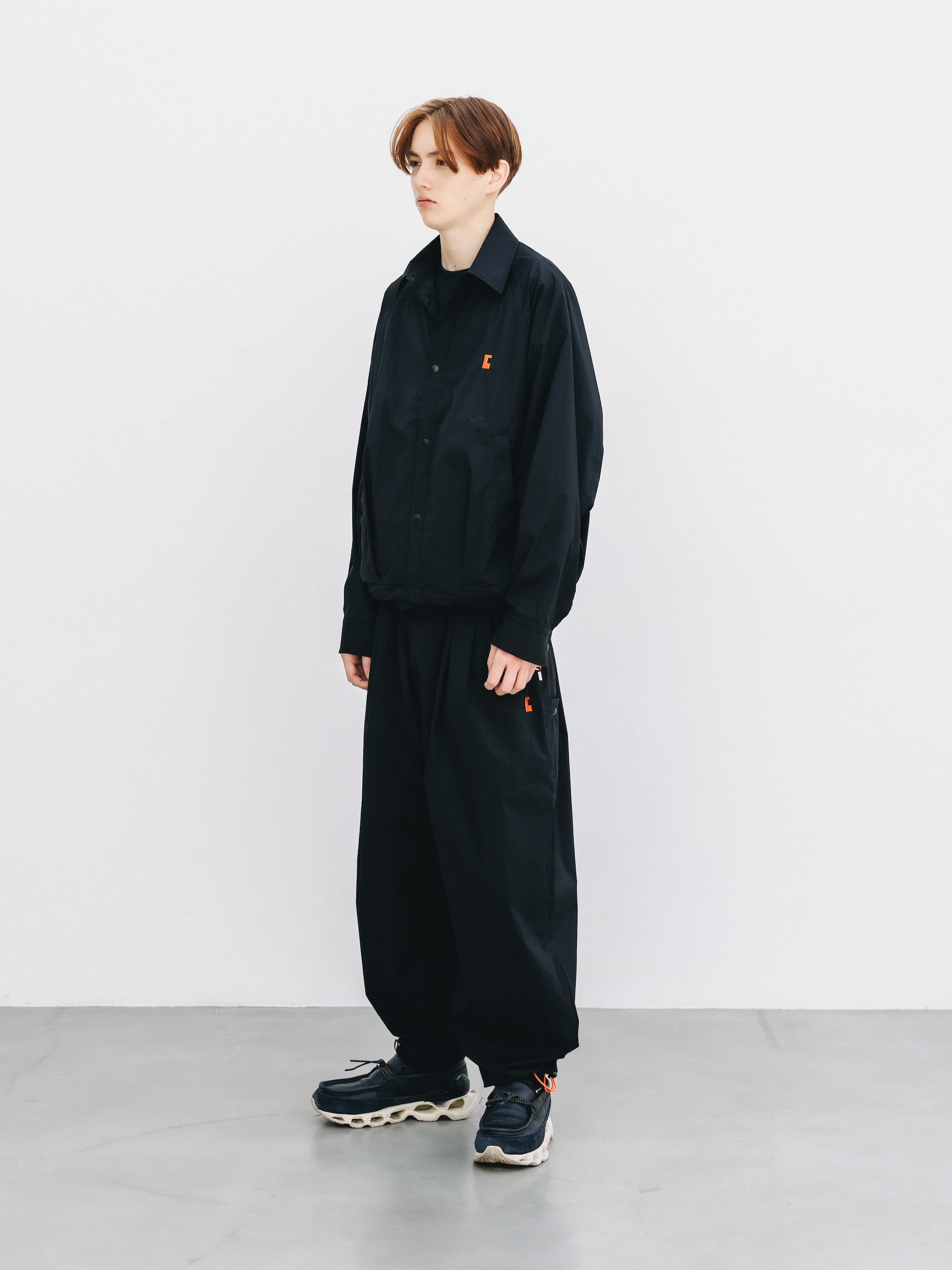 "C” CRISPY NYLON CITY UNIFORM WIDE TAPERED PANTS (BLACK×ORANGE)