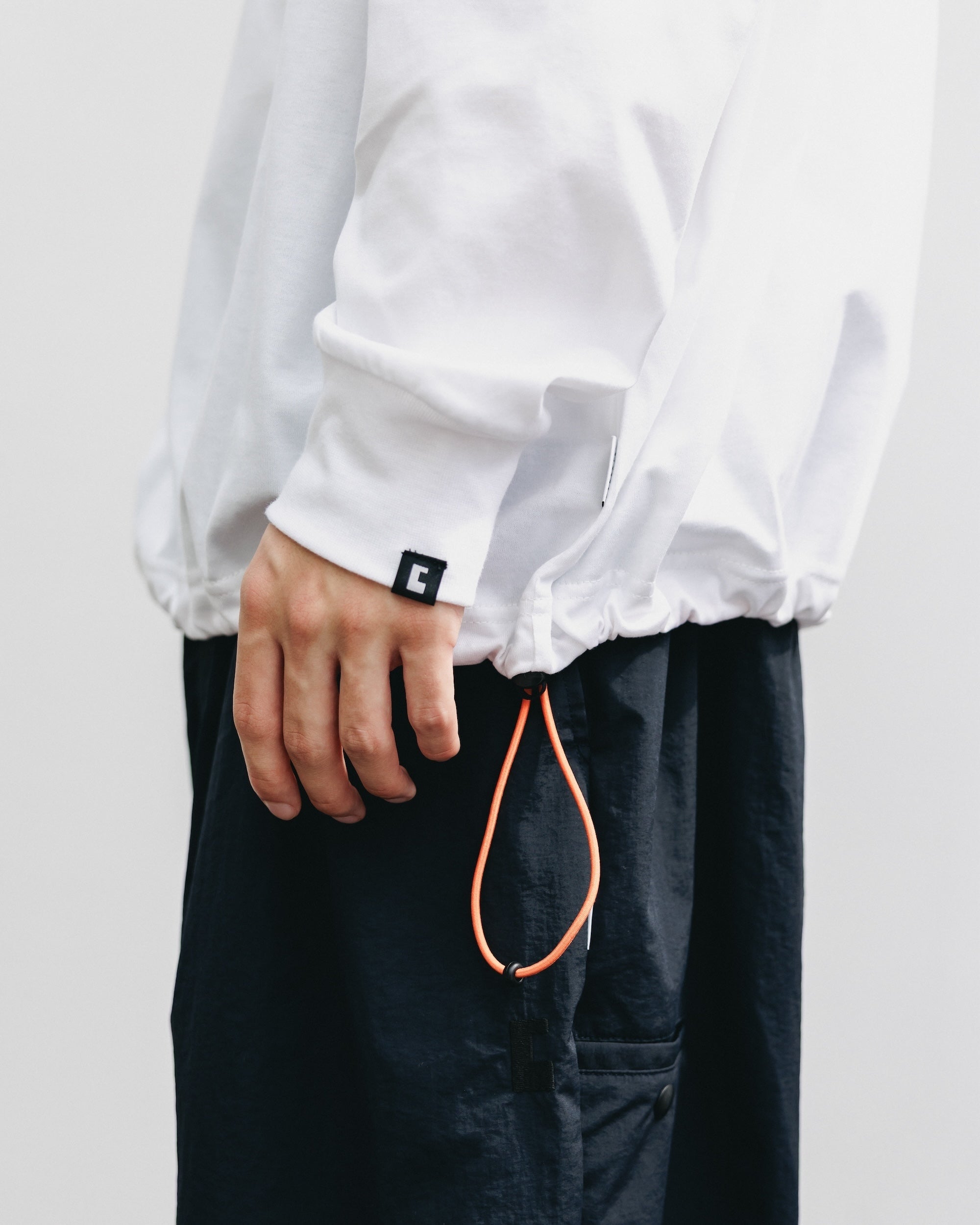 【10.15 WED 20:00- IN STOCK】"C×YGM"STAFF L/S T-SHIRT WITH DRAWSTRINGS (WHITE)