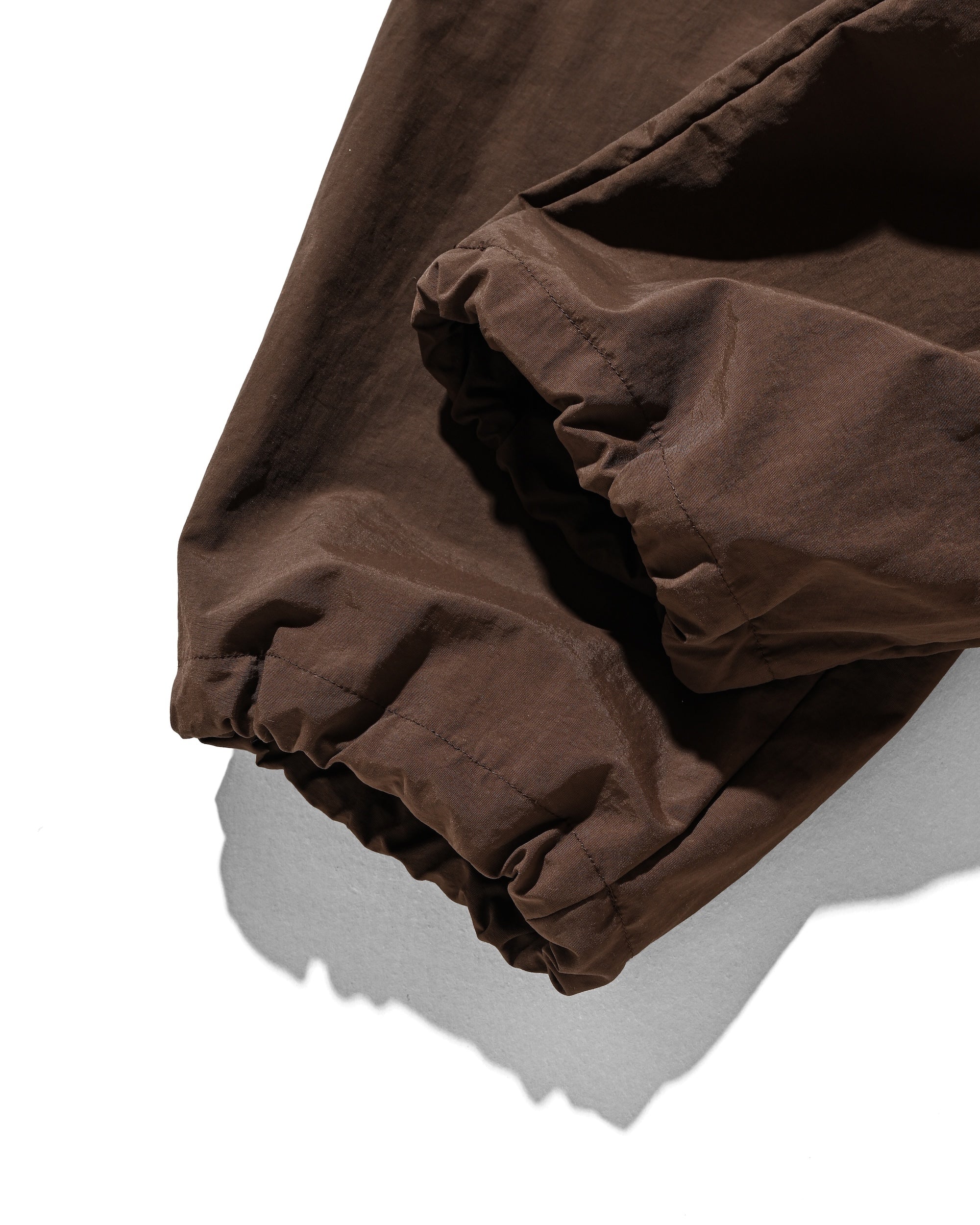 【10.15 WED 20:00- IN STOCK】WATER REPELLENT NYLON CITY UNIFORM WIDE TAPERED PANTS FOR YGM (BROWN×ORANGE)