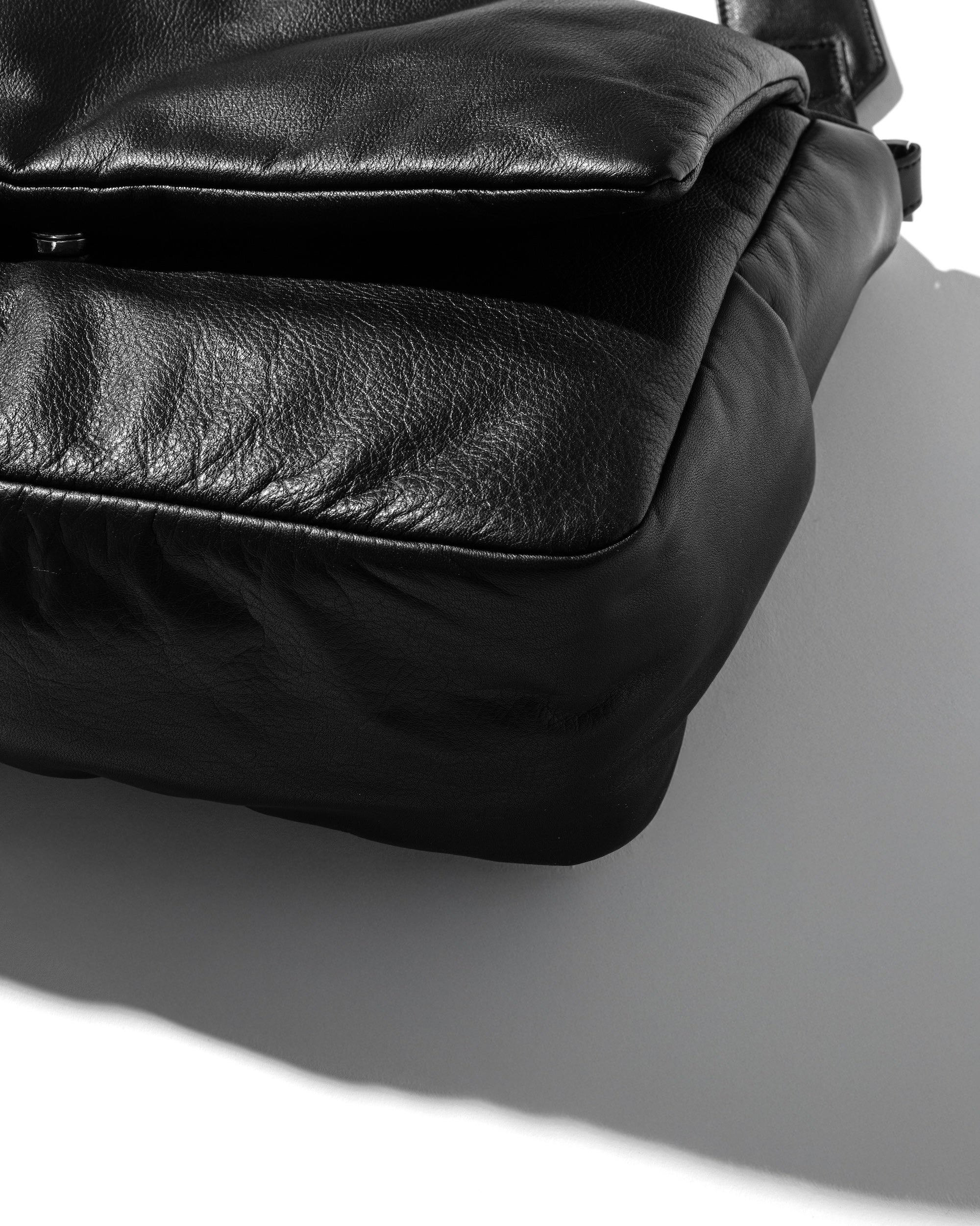 LEATHER PADDED FLAP HOLIDAY BAG