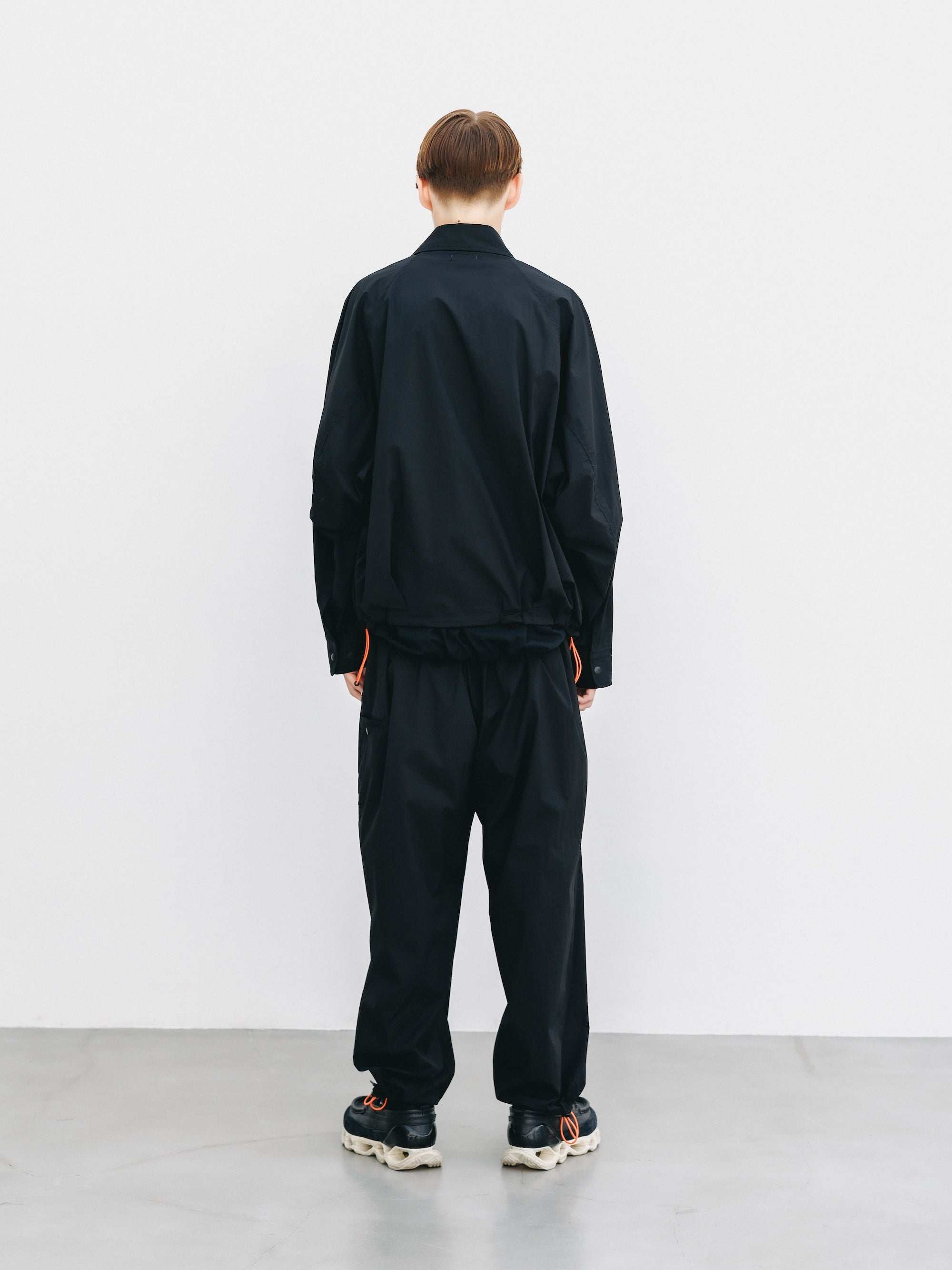 "C” CRISPY NYLON CITY UNIFORM WIDE TAPERED PANTS (BLACK×ORANGE)