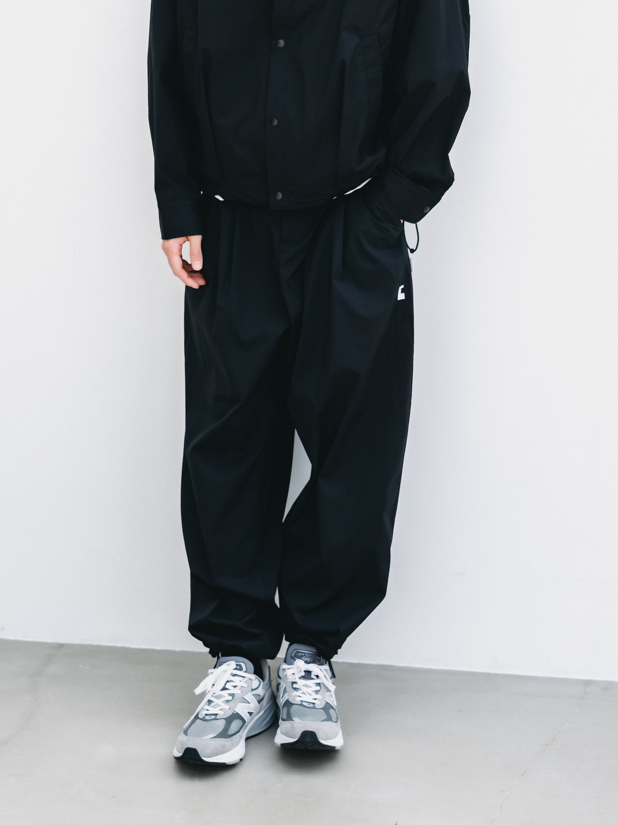 C” CRISPY NYLON CITY UNIFORM WIDE TAPERED PANTS (BLACK×WHITE)