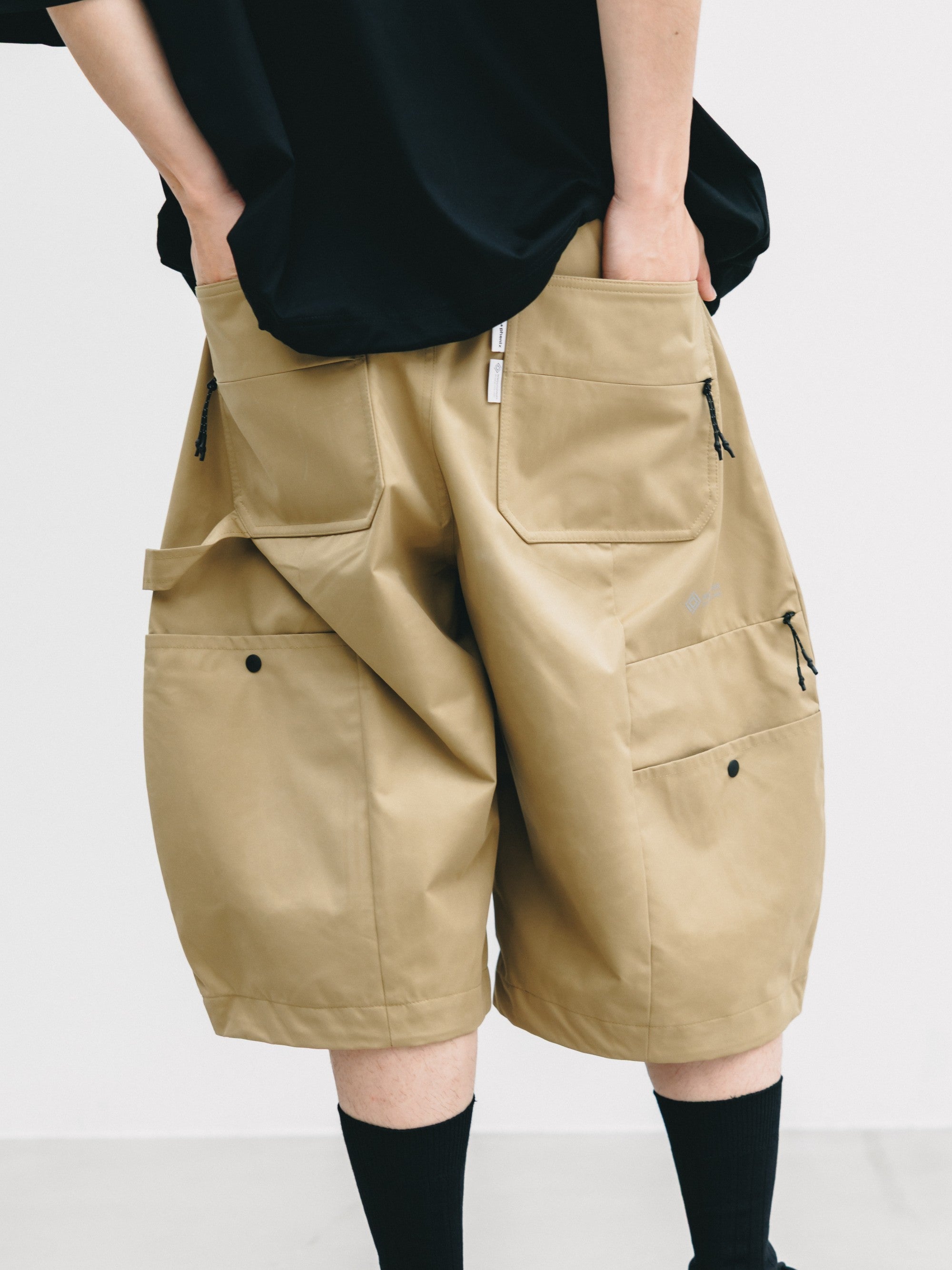 【7.8 WED 20:00- IN STOCK】+PHENIX WINDSTOPPER® BY GORE-TEX LABS TWILL CITY MASSIVE UTILITY HALF PANTS (CAMEL BEIGE)