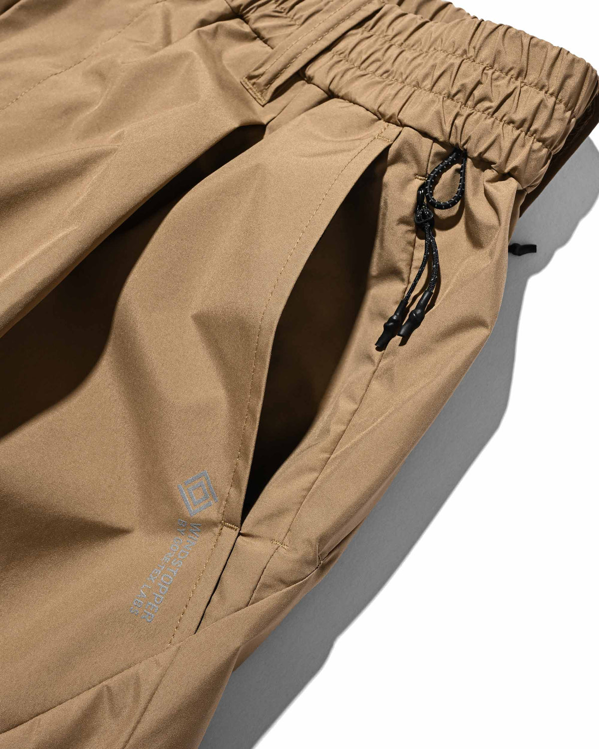 【9.23 WED 20:00- IN STOCK】+phenix WINDSTOPPER® by GORE-TEX LABS TECH MASSIVE TWISTED PANTS (CAMEL BEIGE)