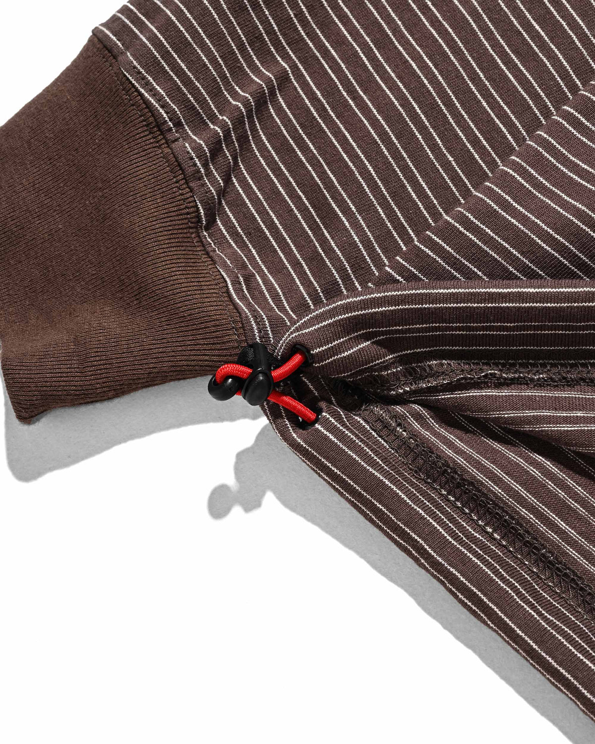 【10.4 SUN 20:00- IN STOCK】【LIMITED】 “YES G♡♡D MARKET" MICRO STRIPED L/S T-SHIRT WITH DRAWSTRINGS (BROWN)